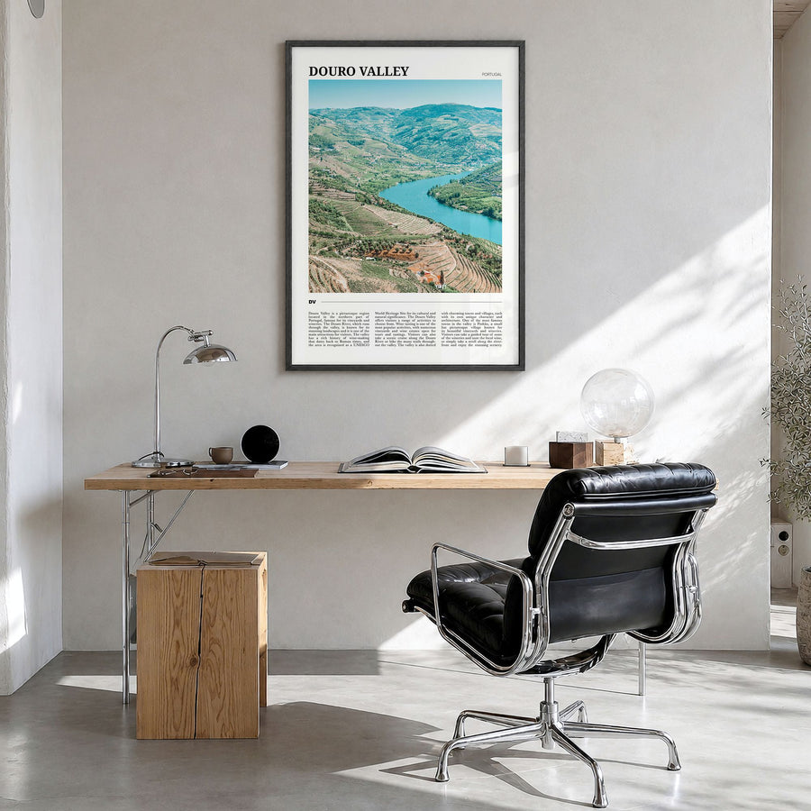 Douro Valley Travel Poster in a black wood frame, hanging in a bright home office