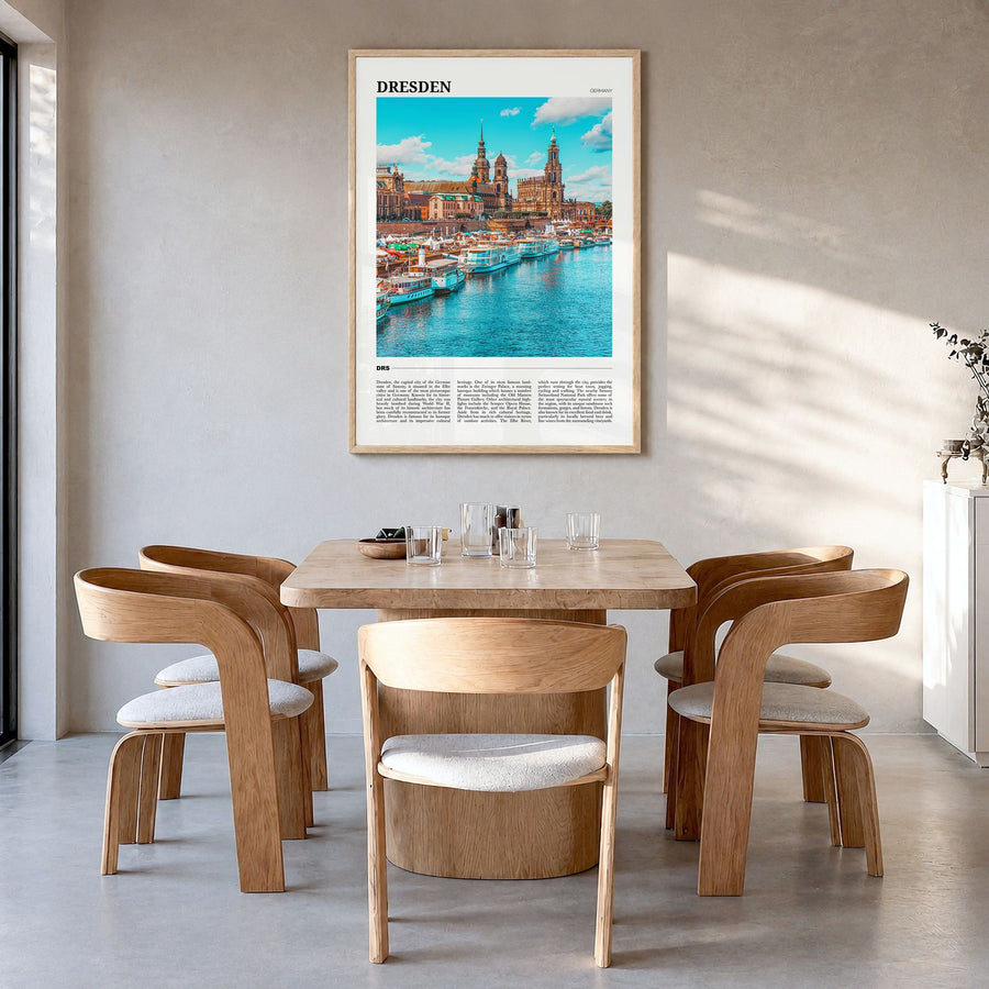Dresden Travel Poster in a natural wood frame, hanging in a dining room