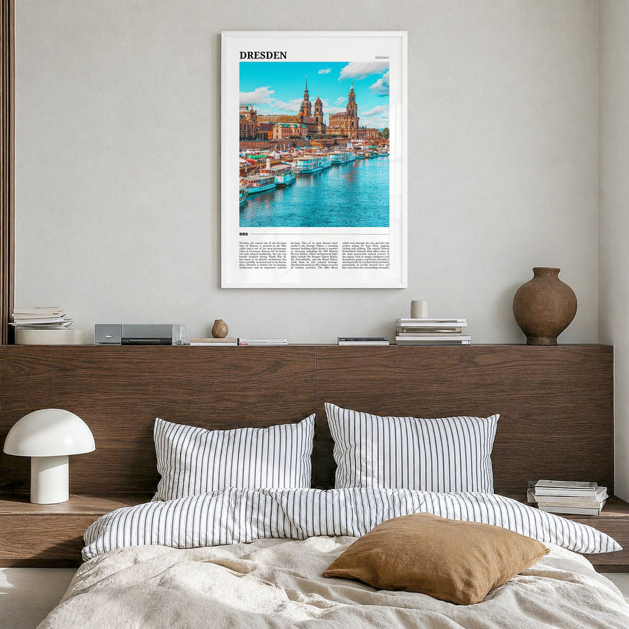 Dresden Travel Poster in a white wood frame, hanging in a bedroom