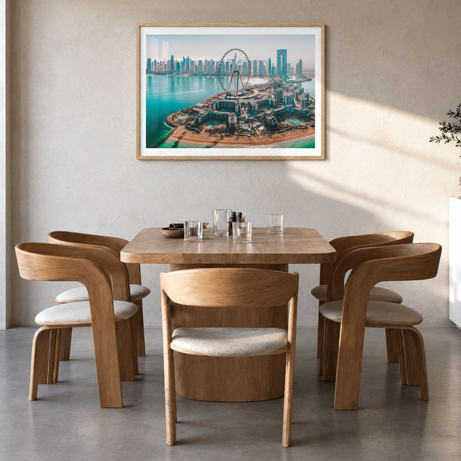 Dubai Photo Poster in a natural wood frame, hanging in a dining room, white border