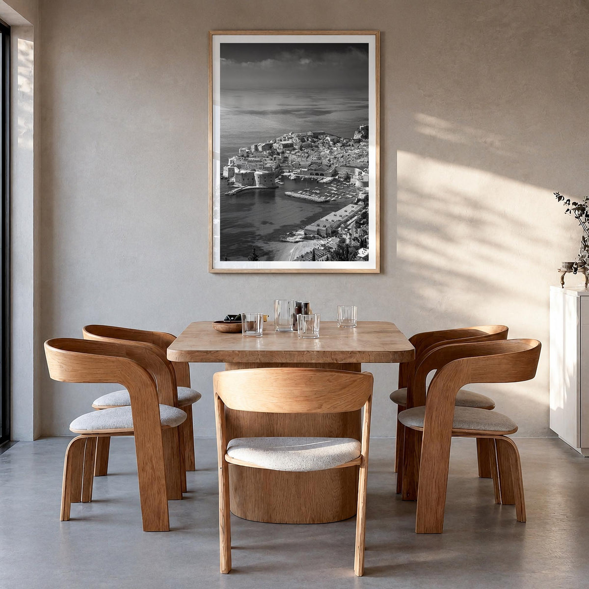 Dubrovnik black & white photo poster of Croatia – vertical wall art in natural wood frame with white border, hanging on wall