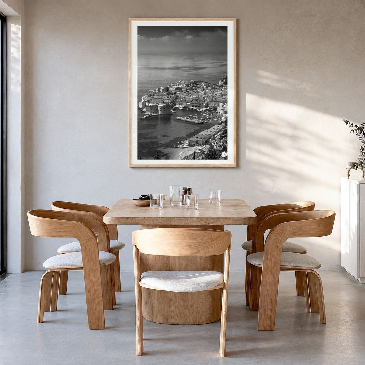 Dubrovnik Photo Poster in a natural wood frame, hanging in a dining room, white border