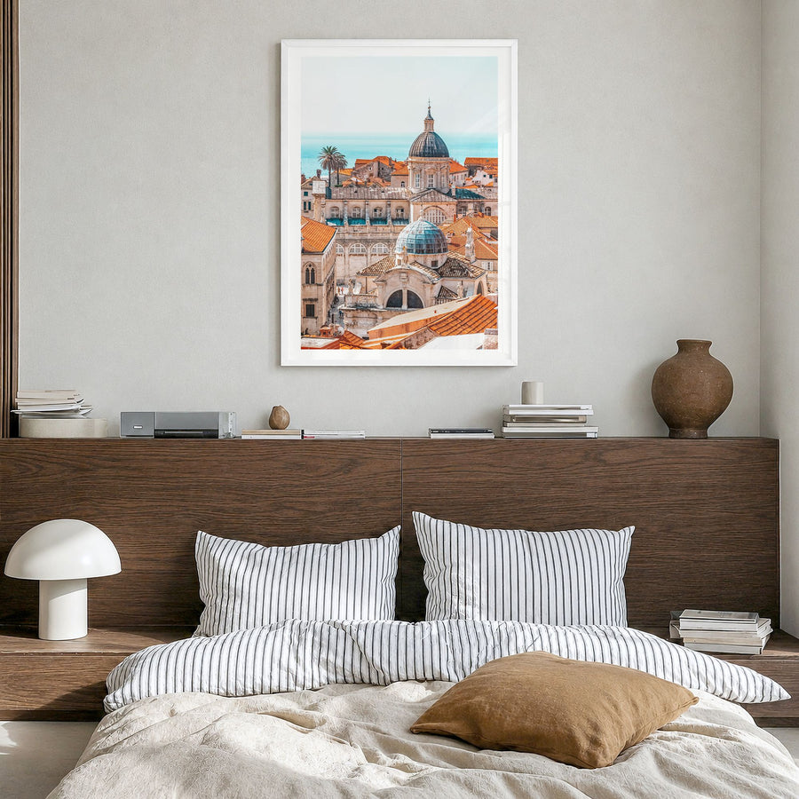 Dubrovnik Photo Poster in a white wood frame, hanging in a bedroom, white border