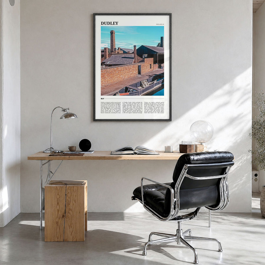 Dudley Travel Poster in a black wood frame, hanging in a bright home office