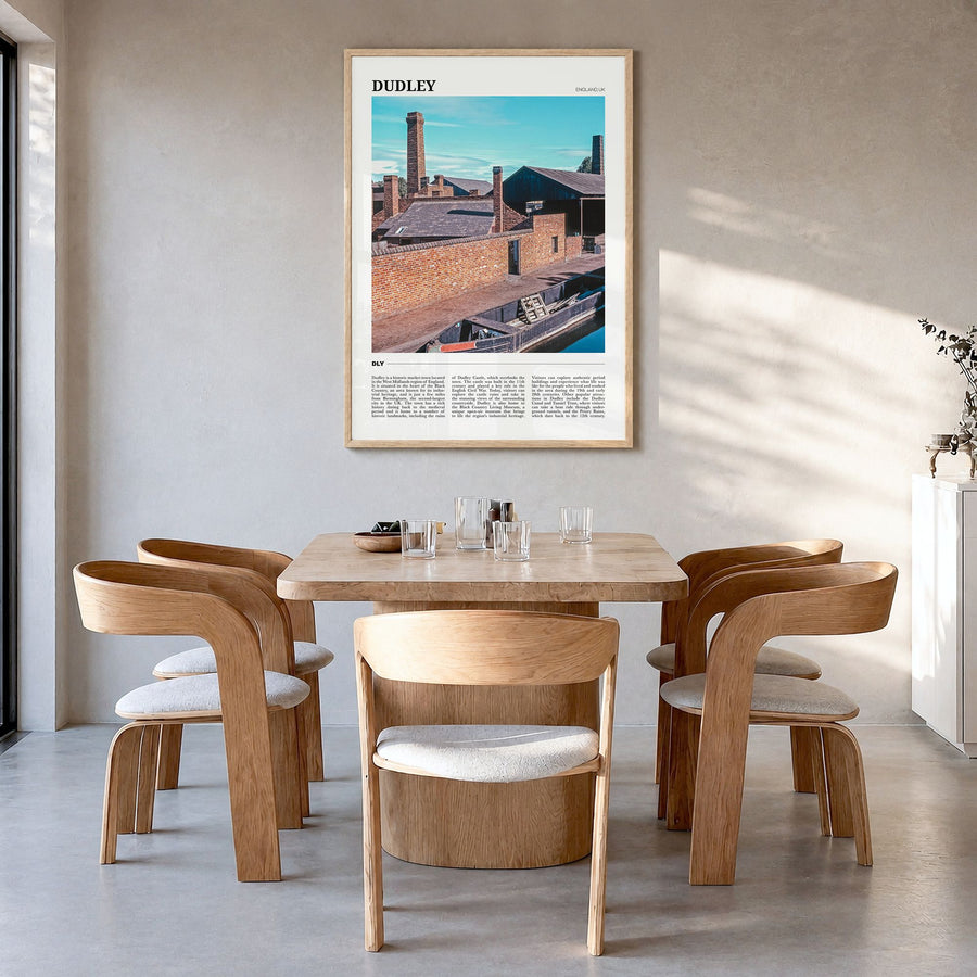 Dudley Travel Poster in a natural wood frame, hanging in a dining room