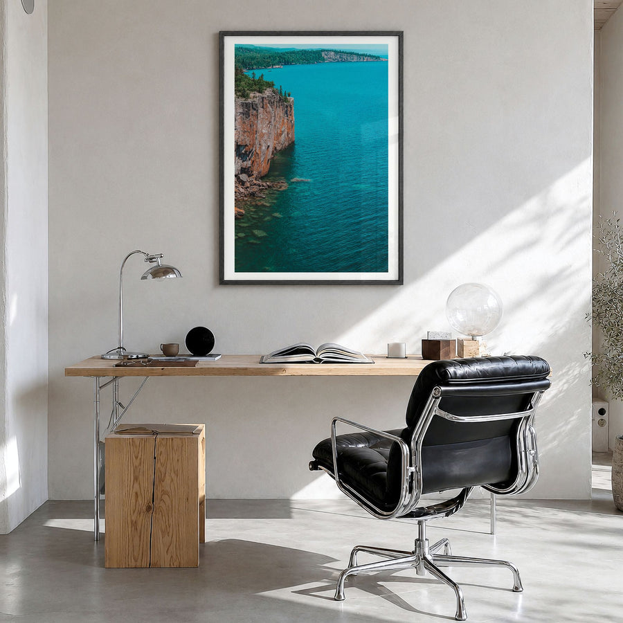 Duluth Photo Poster in a black wood frame, hanging in a bright home office, white border