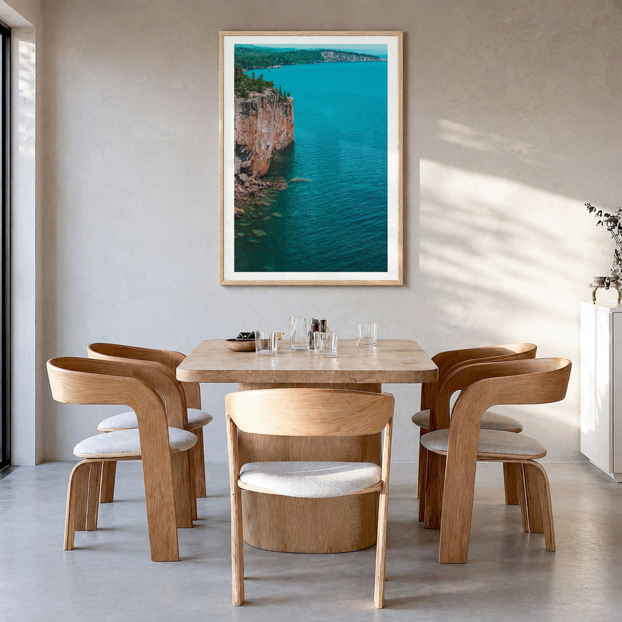 Duluth Photo Poster in a natural wood frame, hanging in a dining room, white border