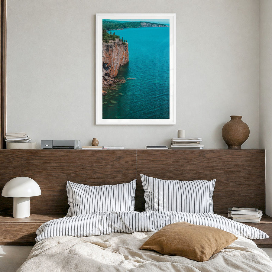 Duluth Photo Poster in a white wood frame, hanging in a bedroom, white border