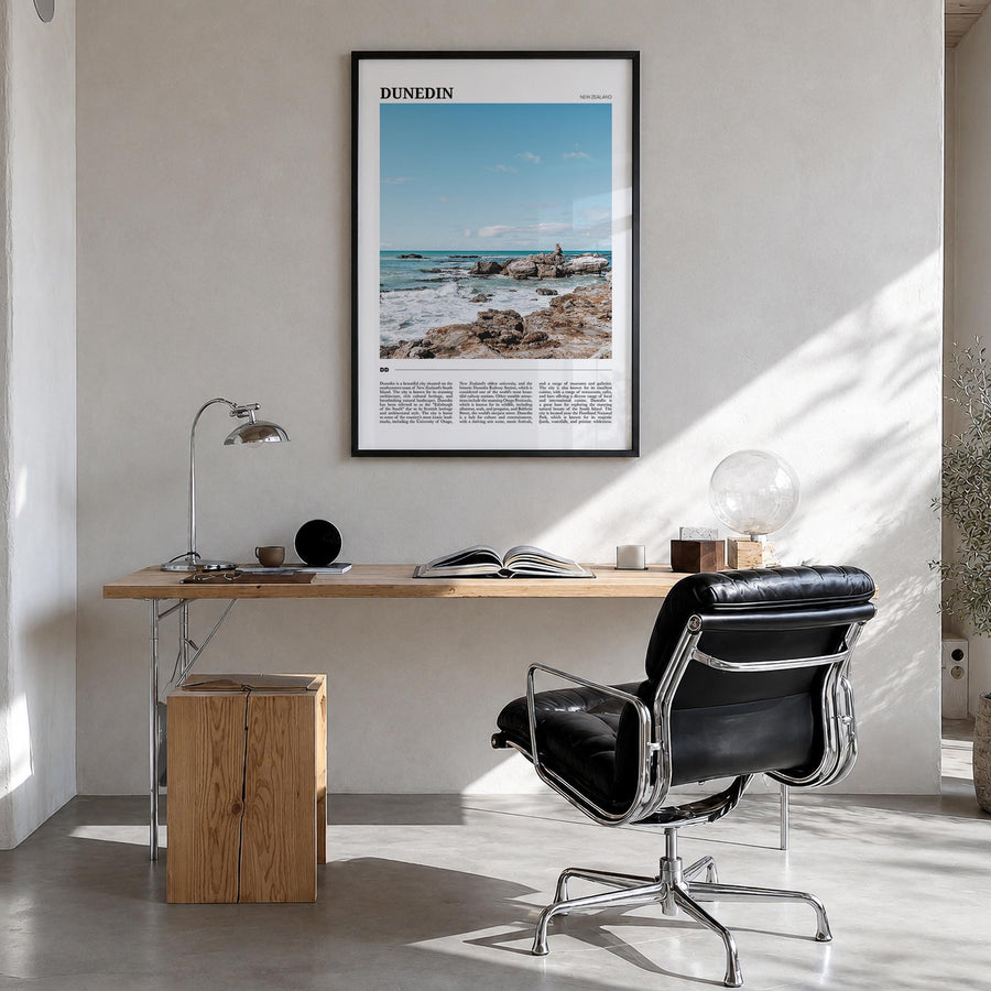 Dunedin no. 2 colorful travel poster of New Zealand – vertical wall art in black wood frame, hanging on wall