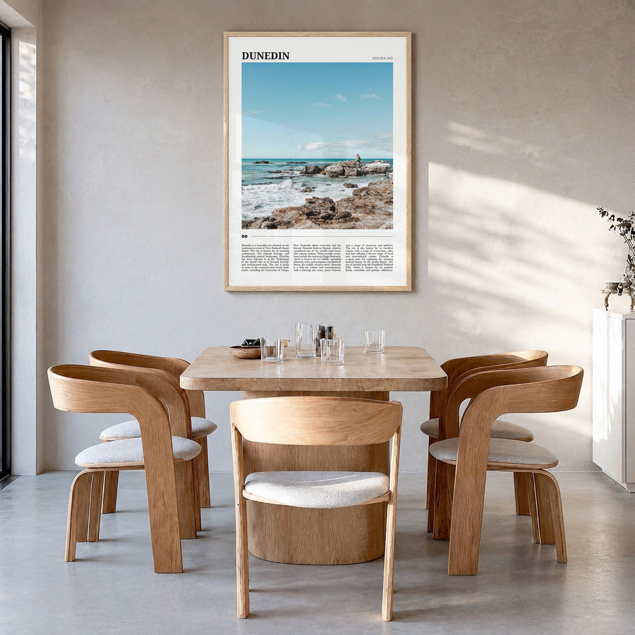 Dunedin Travel No 2 Poster in a natural wood frame, hanging in a dining room