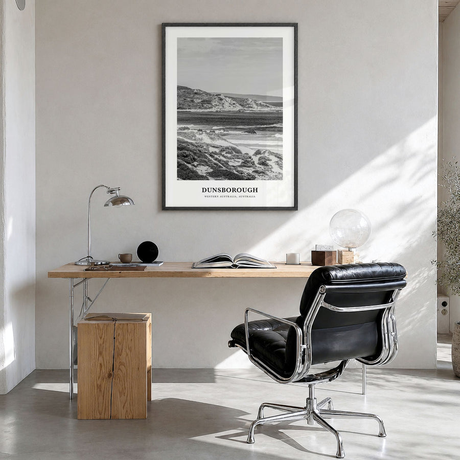 Dunsborough Classic Poster in a black wood frame, hanging in a bright home office