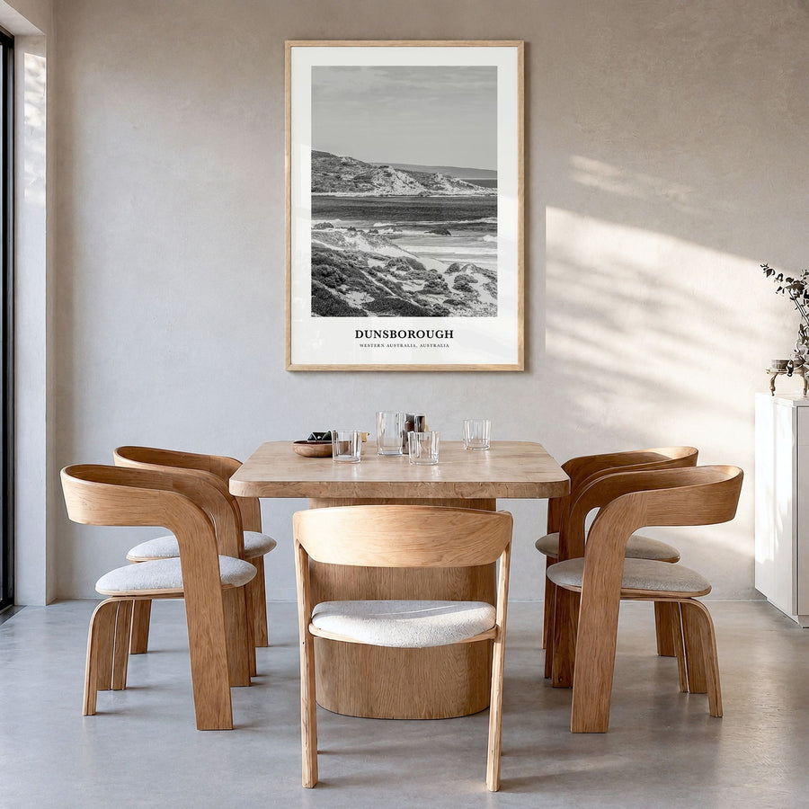 Dunsborough Classic Poster in a natural wood frame, hanging in a dining room