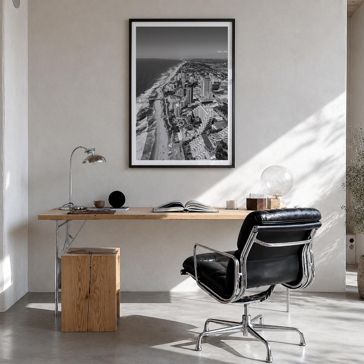 Durban black & white photo poster of South Africa – vertical wall art in black wood frame with white border, hanging on wall