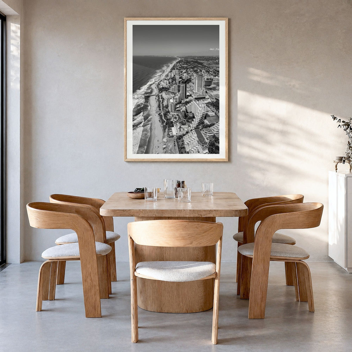 Durban Photo Poster in a natural wood frame, hanging in a dining room, white border