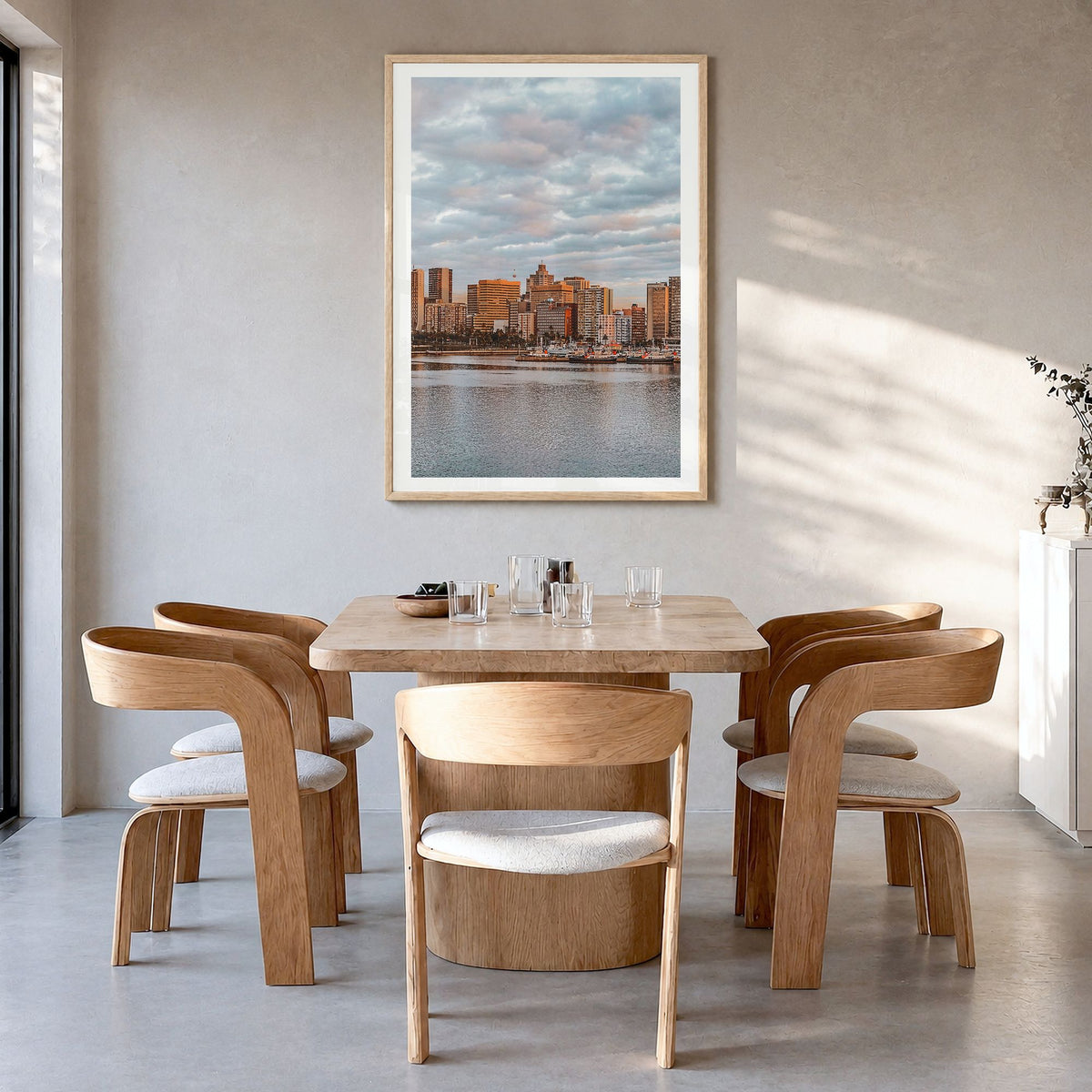 Durban Photo Poster in a natural wood frame, hanging in a dining room, white border