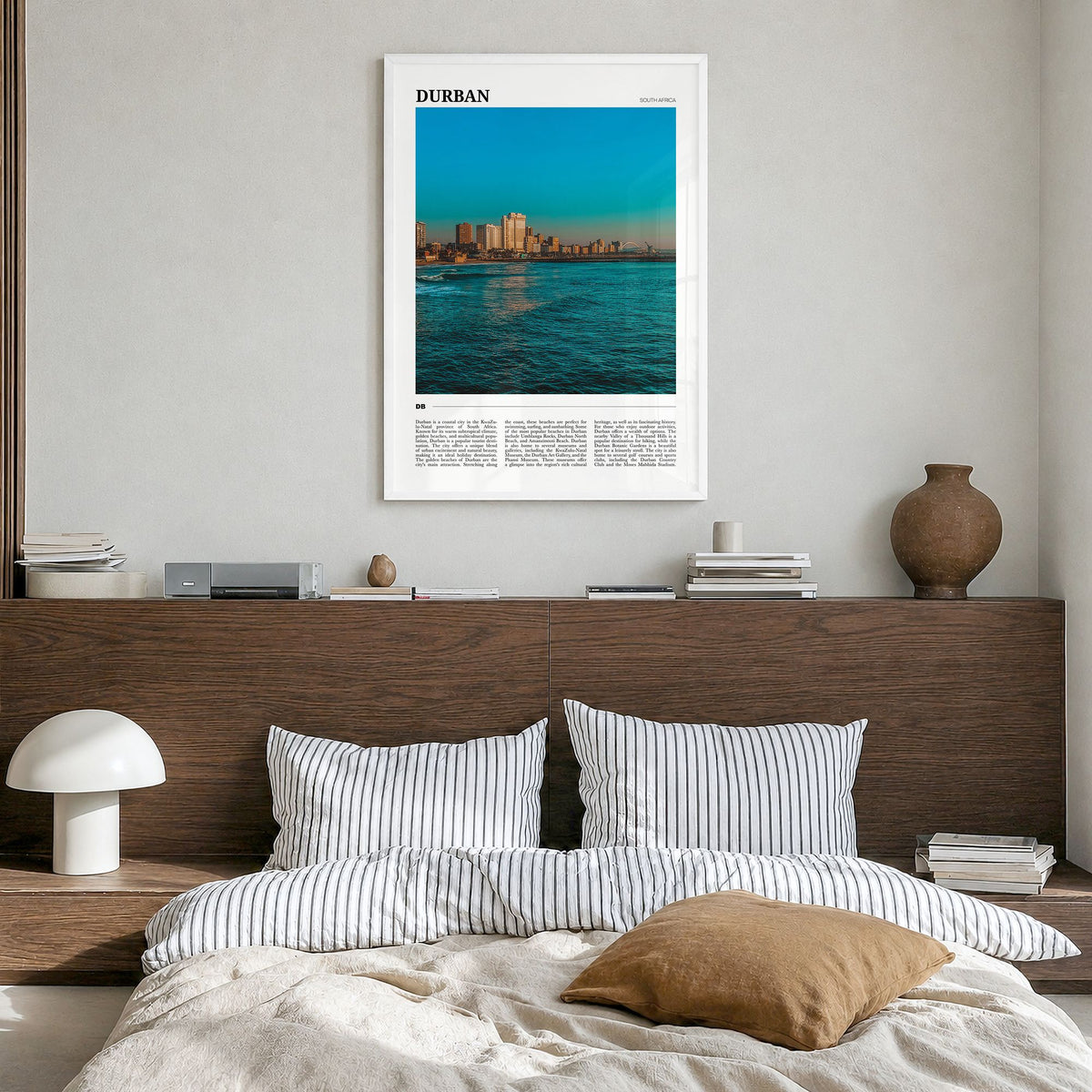 Durban Travel Poster in a white wood frame, hanging in a bedroom
