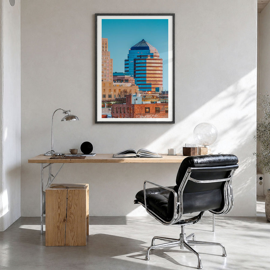 Durham, North Carolina Photo Poster in a black wood frame, hanging in a bright home office, white border
