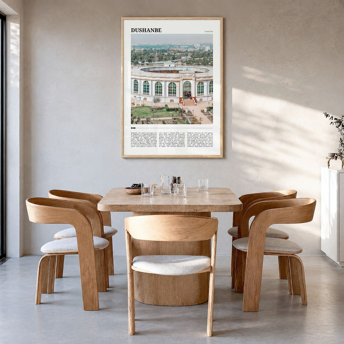 Dushanbe Travel Poster in a natural wood frame, hanging in a dining room
