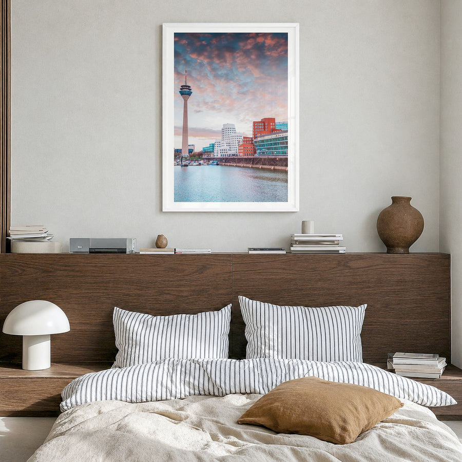 Düsseldorf Photo Poster in a white wood frame, hanging in a bedroom, white border