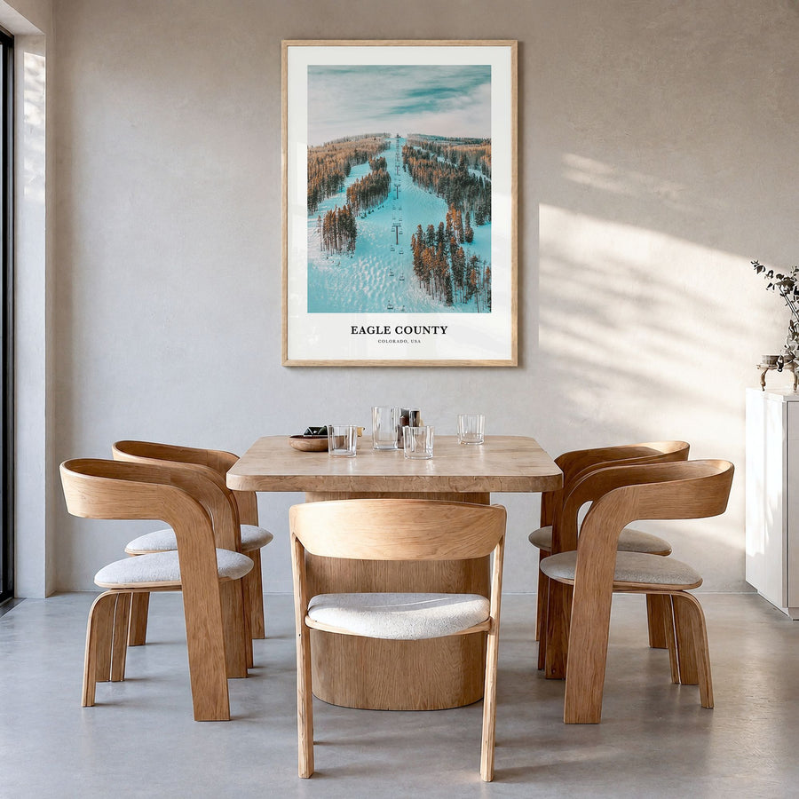 Eagle County Classic Poster in a natural wood frame, hanging in a dining room