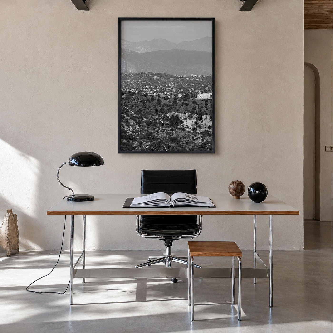 East Los Angeles black & white photo poster of Los Angeles, California – vertical wall art in black wood frame, hanging on wa