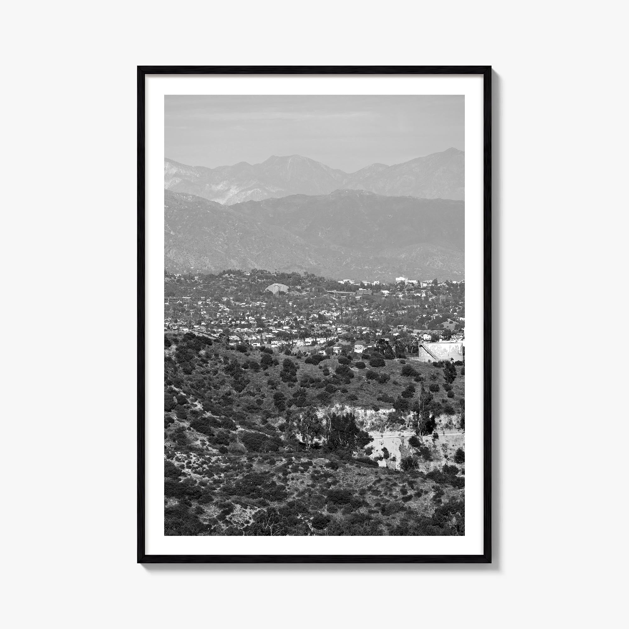 East Los Angeles black & white photo poster of Los Angeles, California – vertical wall art, unframed print shown in interior 
