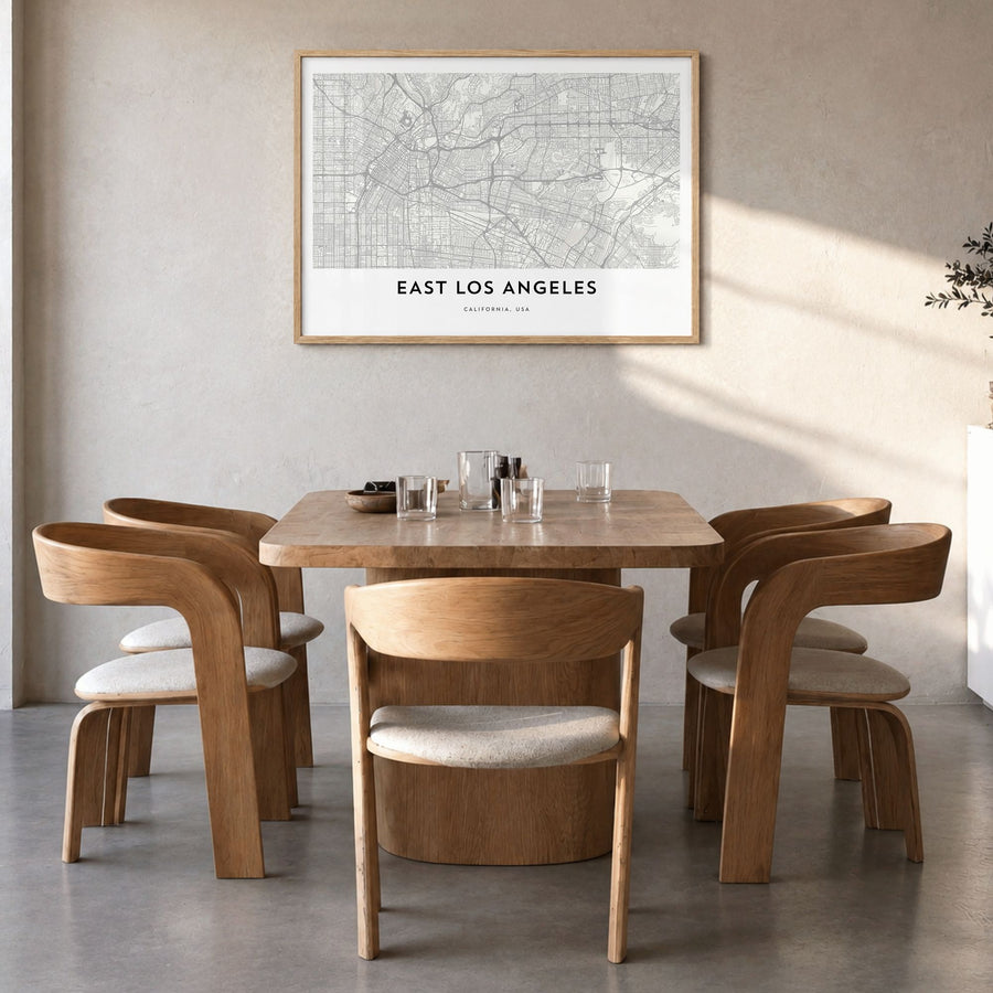 East Los Angeles Map Poster in a natural wood frame, hanging in a dining room