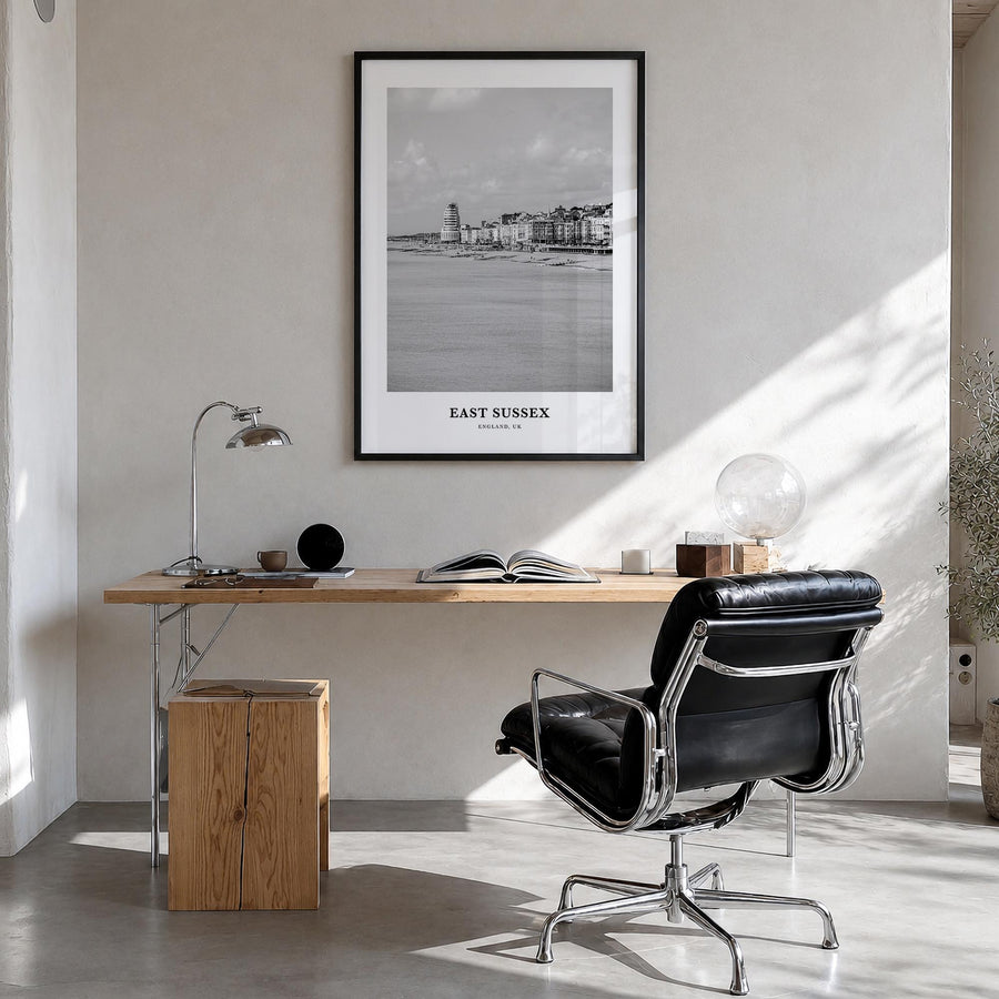 East Sussex black & white classic poster of United Kingdom – vertical wall art in black wood frame, hanging on wall