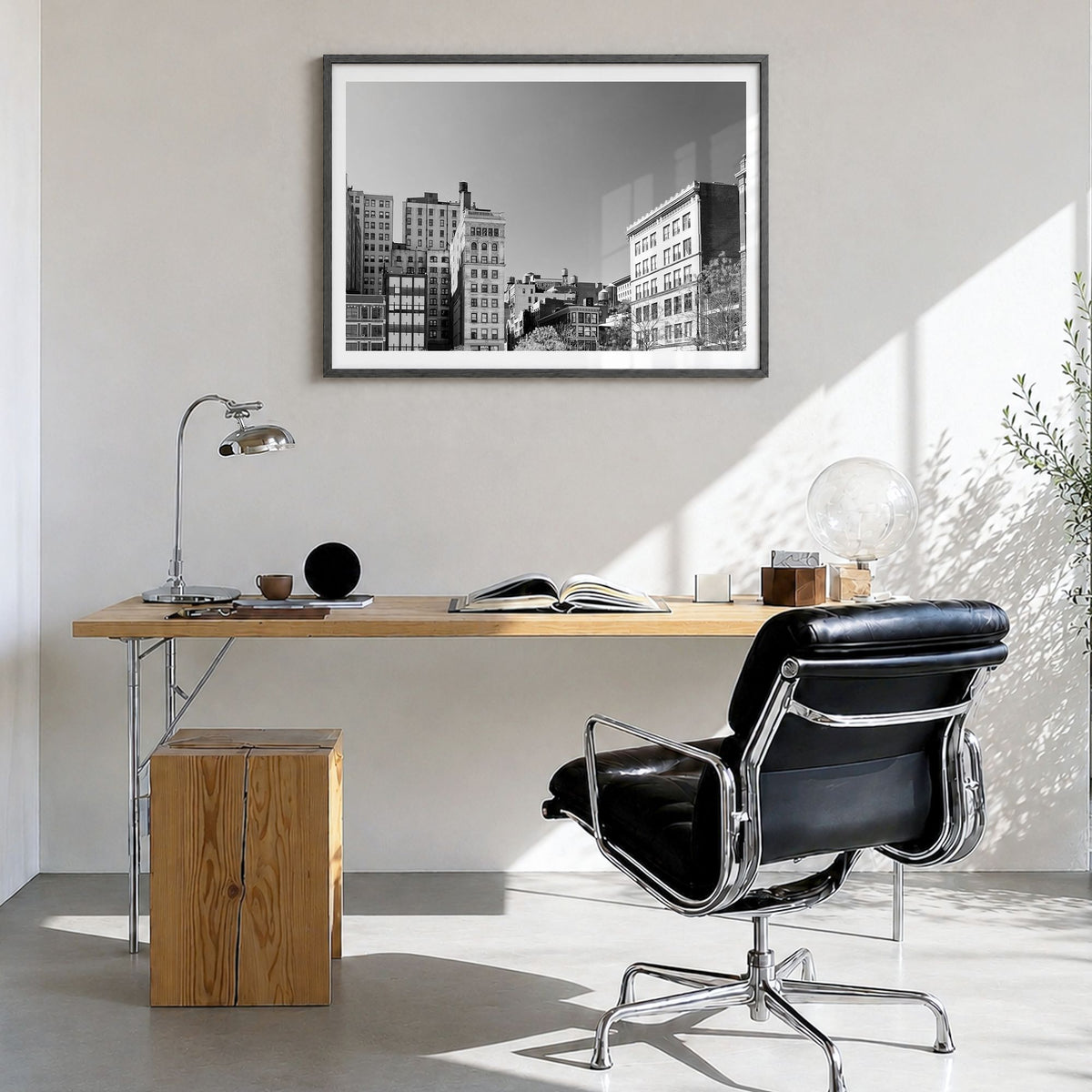 East Village, New York Photo Poster in a black wood frame, hanging in a bright home office, white border