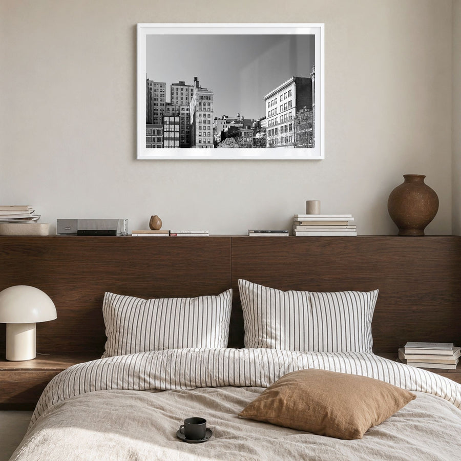East Village, New York Photo Poster in a white wood frame, hanging in a bedroom, white border