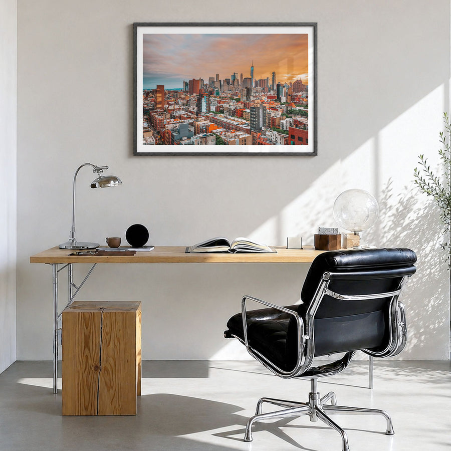East Village, New York Photo Poster in a black wood frame, hanging in a bright home office, white border