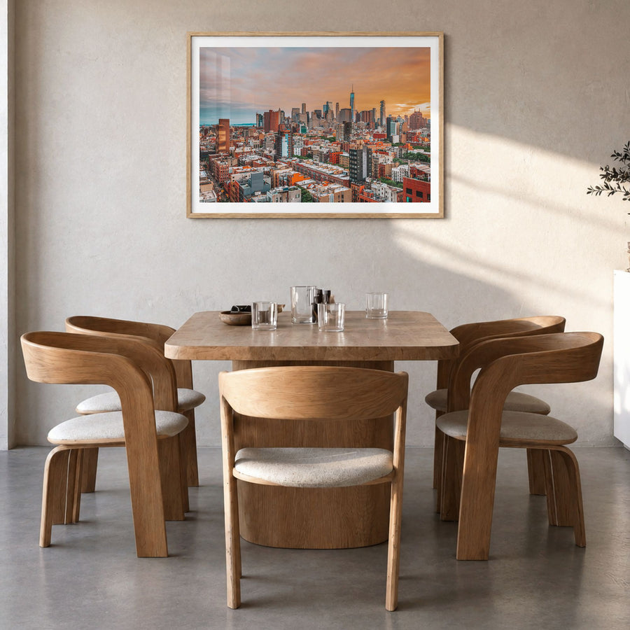 East Village, New York Photo Poster in a natural wood frame, hanging in a dining room, white border