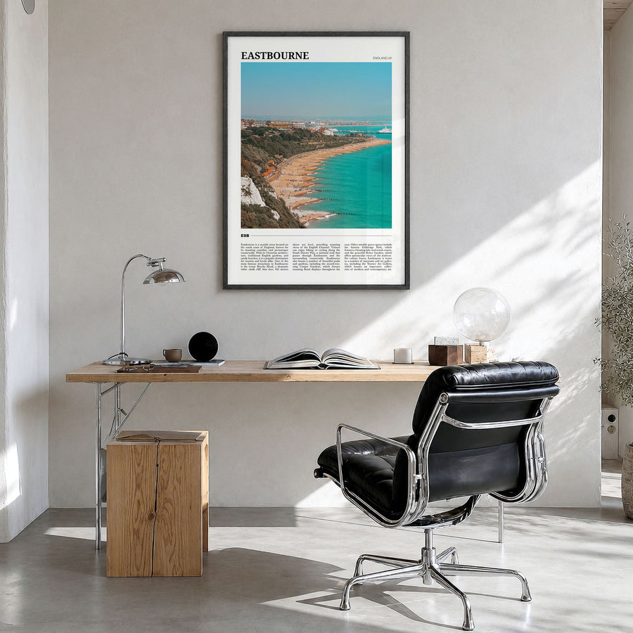 Eastbourne Travel Poster in a black wood frame, hanging in a bright home office
