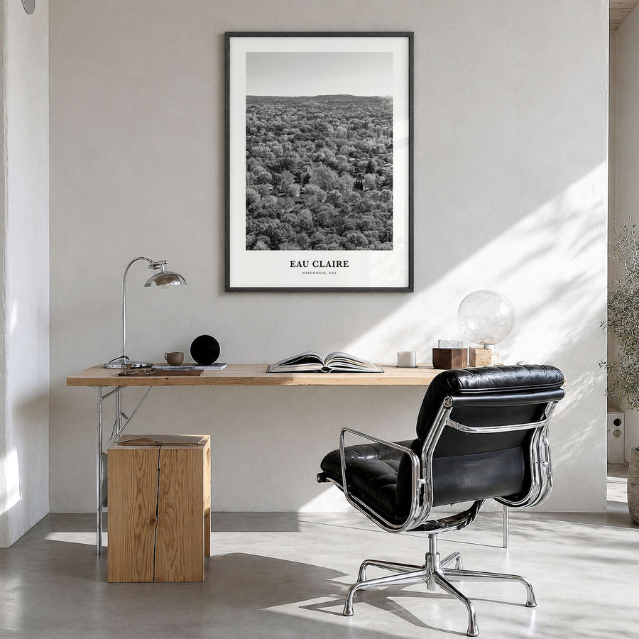 Eau Claire Classic Poster in a black wood frame, hanging in a bright home office