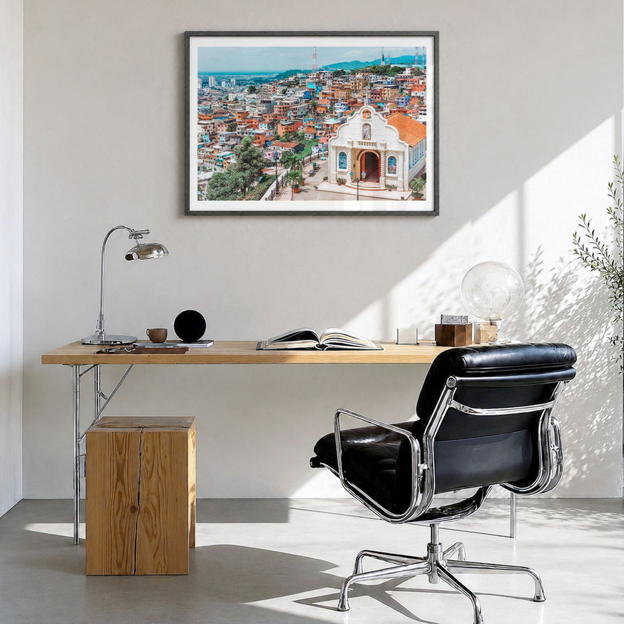 Ecuador Photo Poster in a black wood frame, hanging in a bright home office, white border