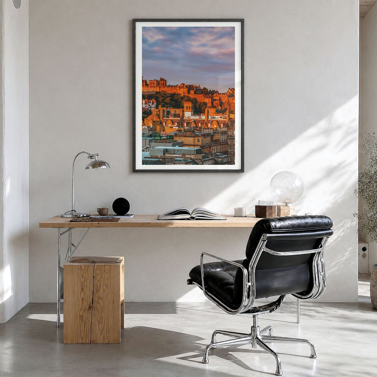 Edinburgh Photo Poster in a black wood frame, hanging in a bright home office, white border