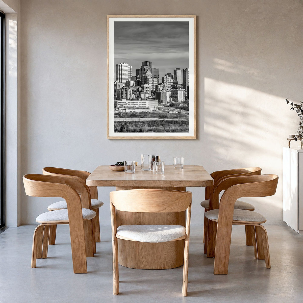 Edmonton Photo Poster in a natural wood frame, hanging in a dining room, white border