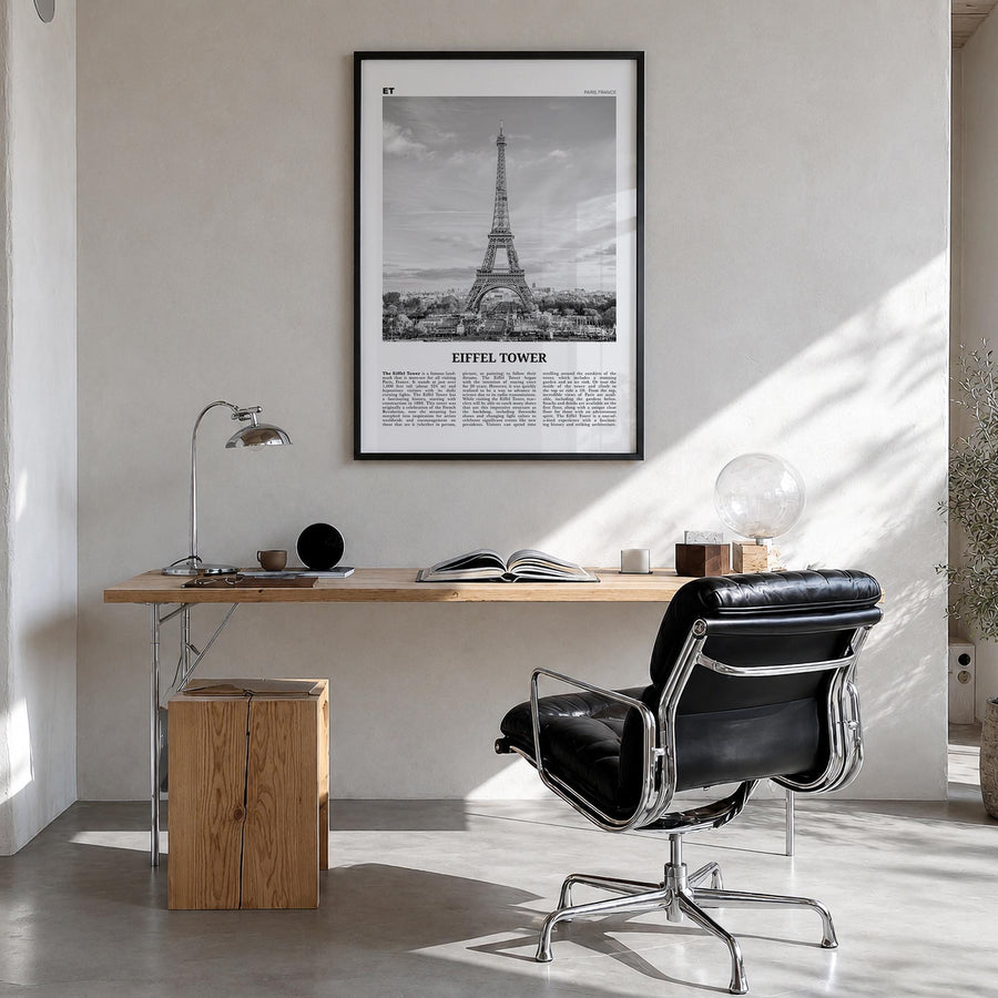 Eiffel Tower black & white newspaper poster of France – vertical wall art in black wood frame, hanging on wall