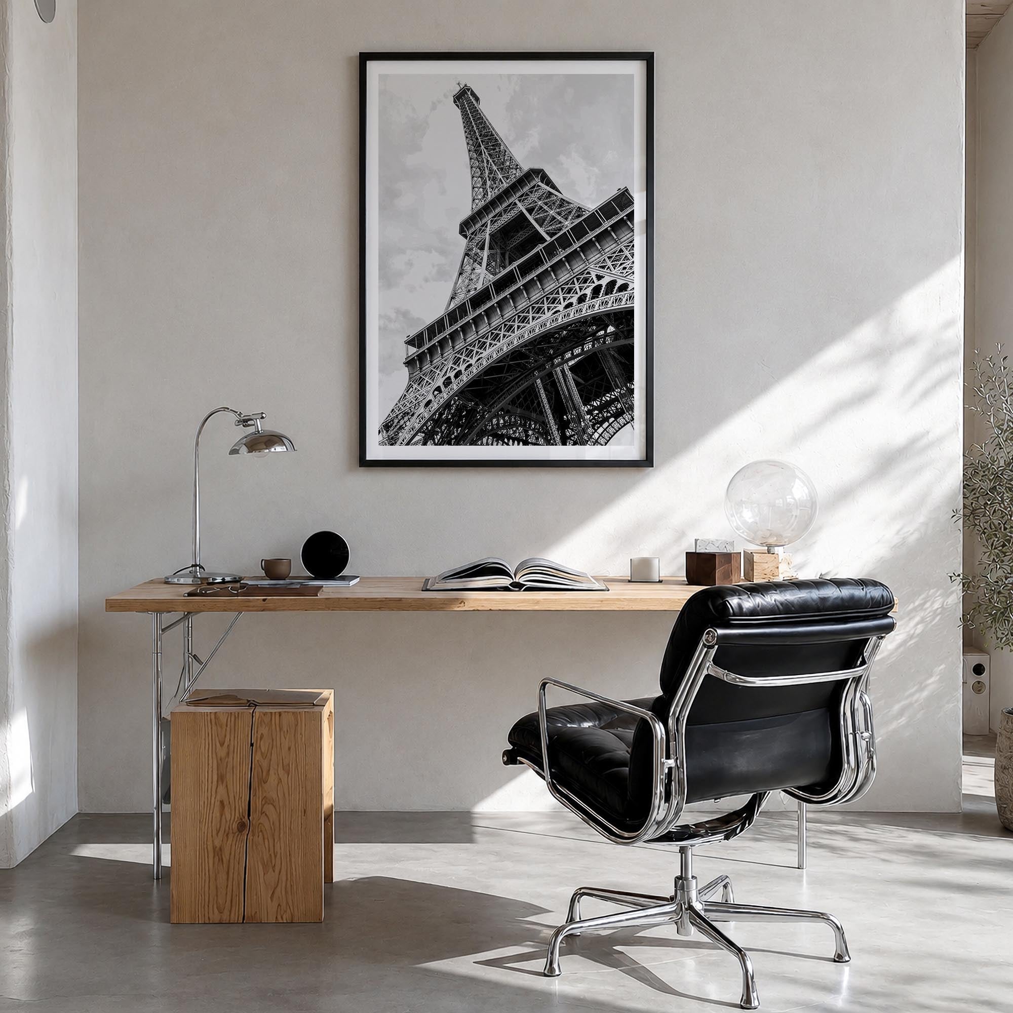 Eiffel Tower black & white photo poster of France – vertical wall art in black wood frame with white border, hanging on wall