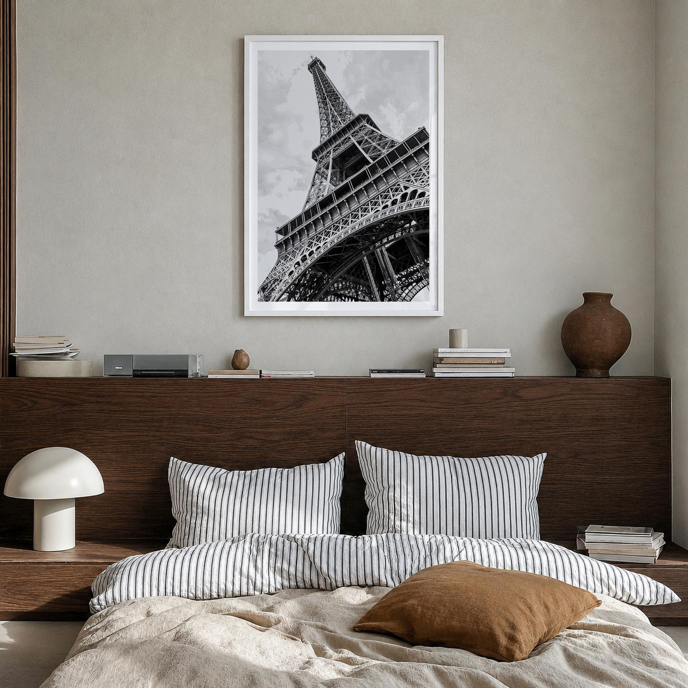 Eiffel Tower black & white photo poster of France – vertical wall art in white wood frame with white border, hanging on wall