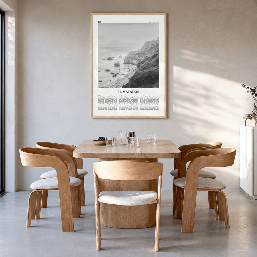 El Matador Newspaper Poster in a natural wood frame, hanging in a dining room