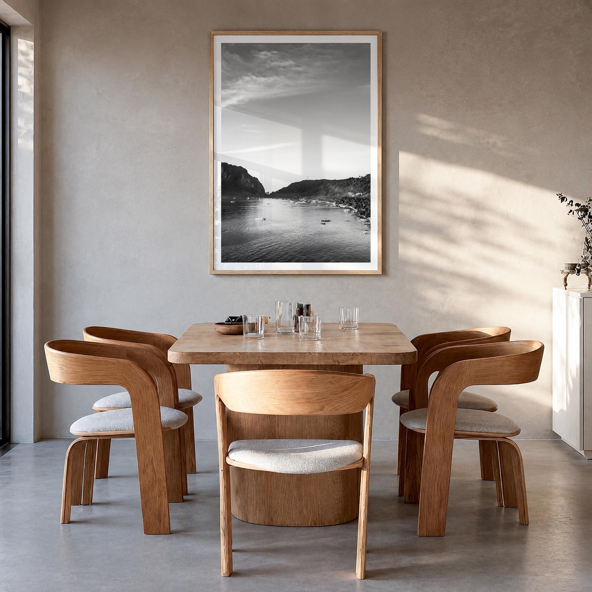 El Nido black & white photo poster of Philippines – vertical wall art in natural wood frame with white border, hanging on wal