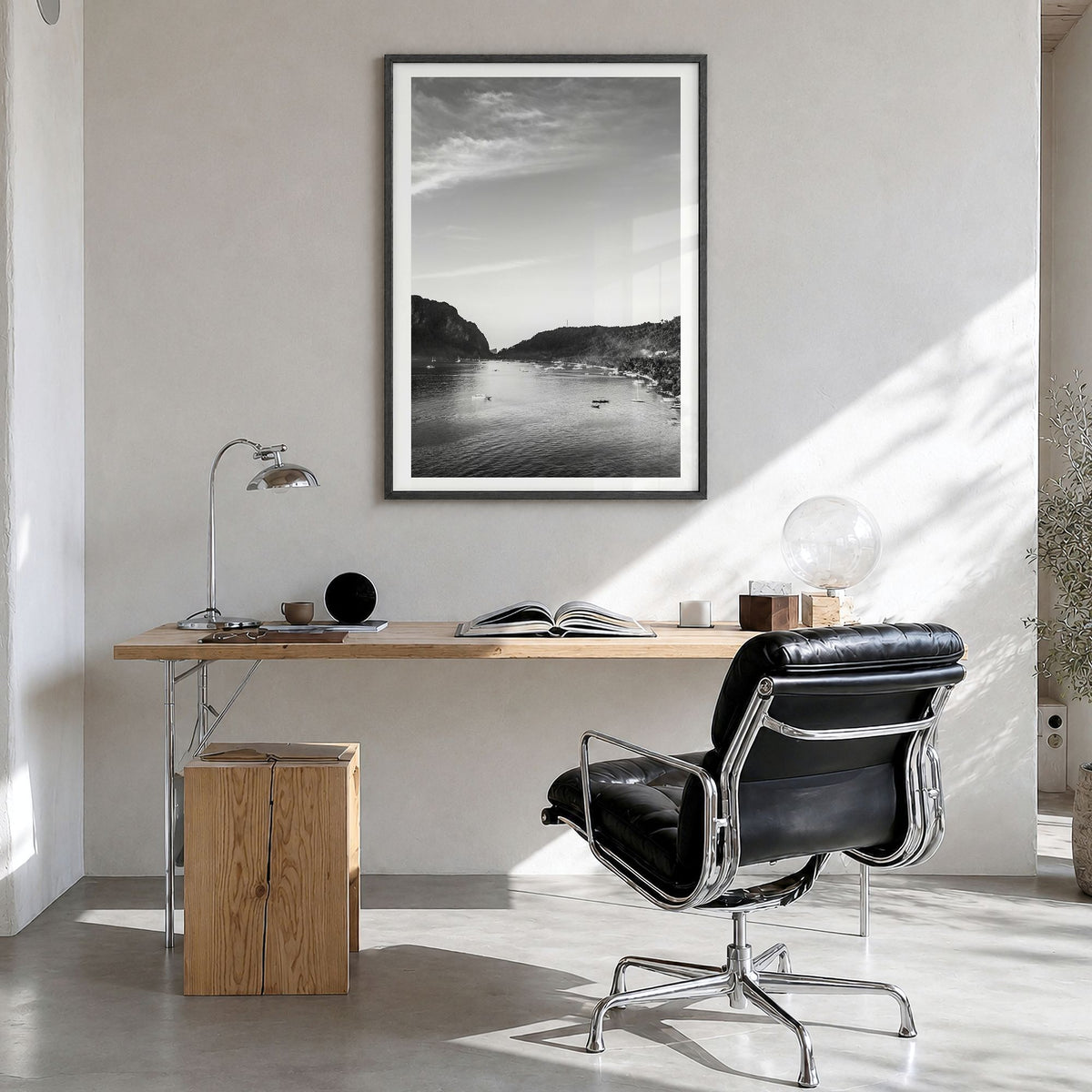 El Nido Photo Poster in a black wood frame, hanging in a bright home office, white border