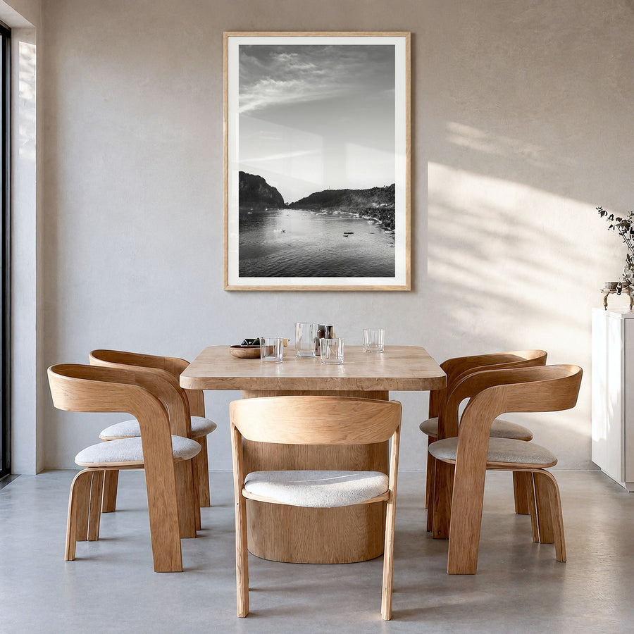 El Nido Photo Poster in a natural wood frame, hanging in a dining room, white border