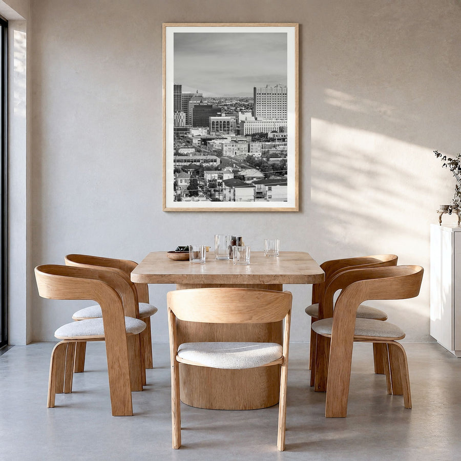 El Paso Photo Poster in a natural wood frame, hanging in a dining room, white border