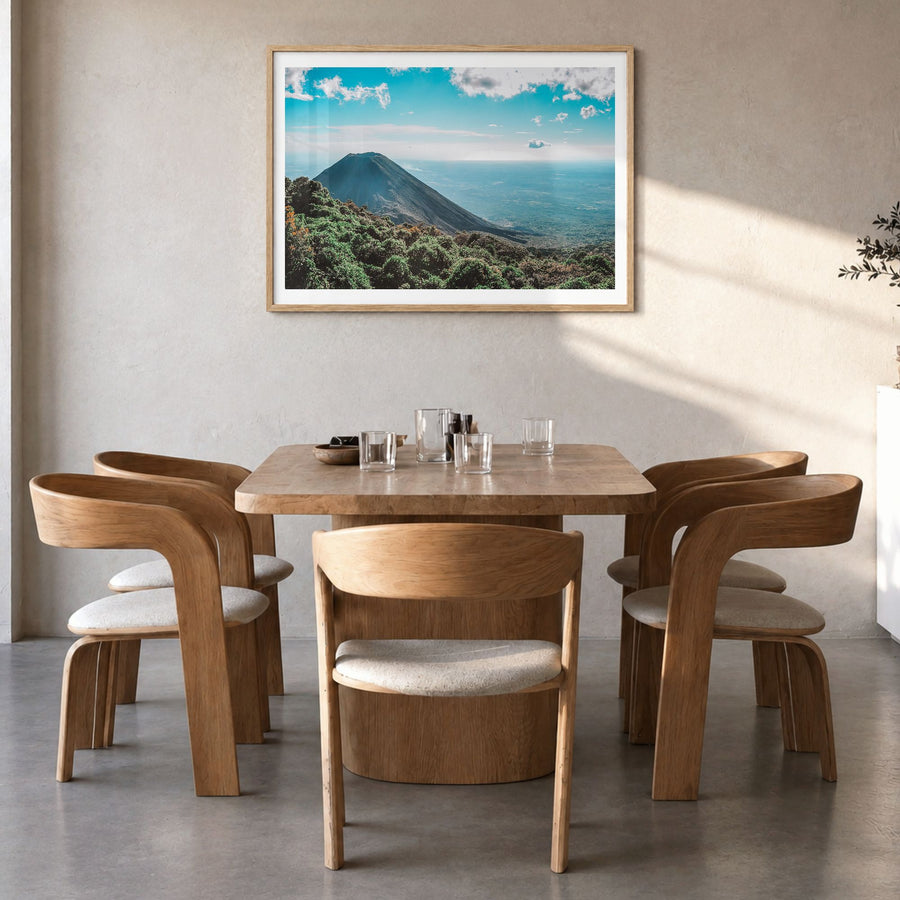 El Salvador Photo Poster in a natural wood frame, hanging in a dining room, white border