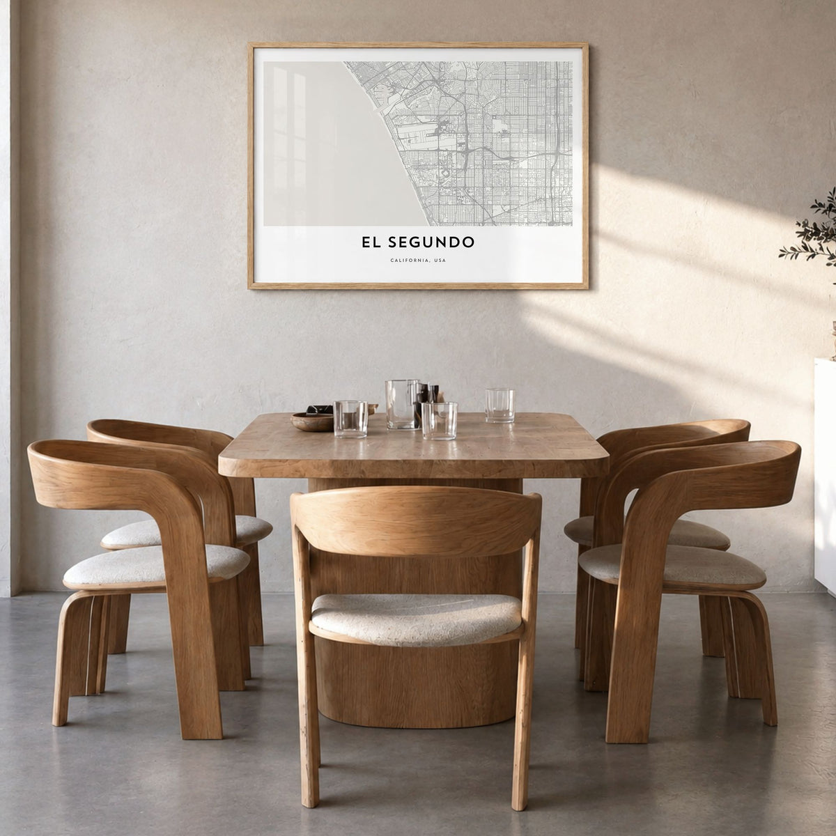 El Segundo Map Poster in a natural wood frame, hanging in a dining room