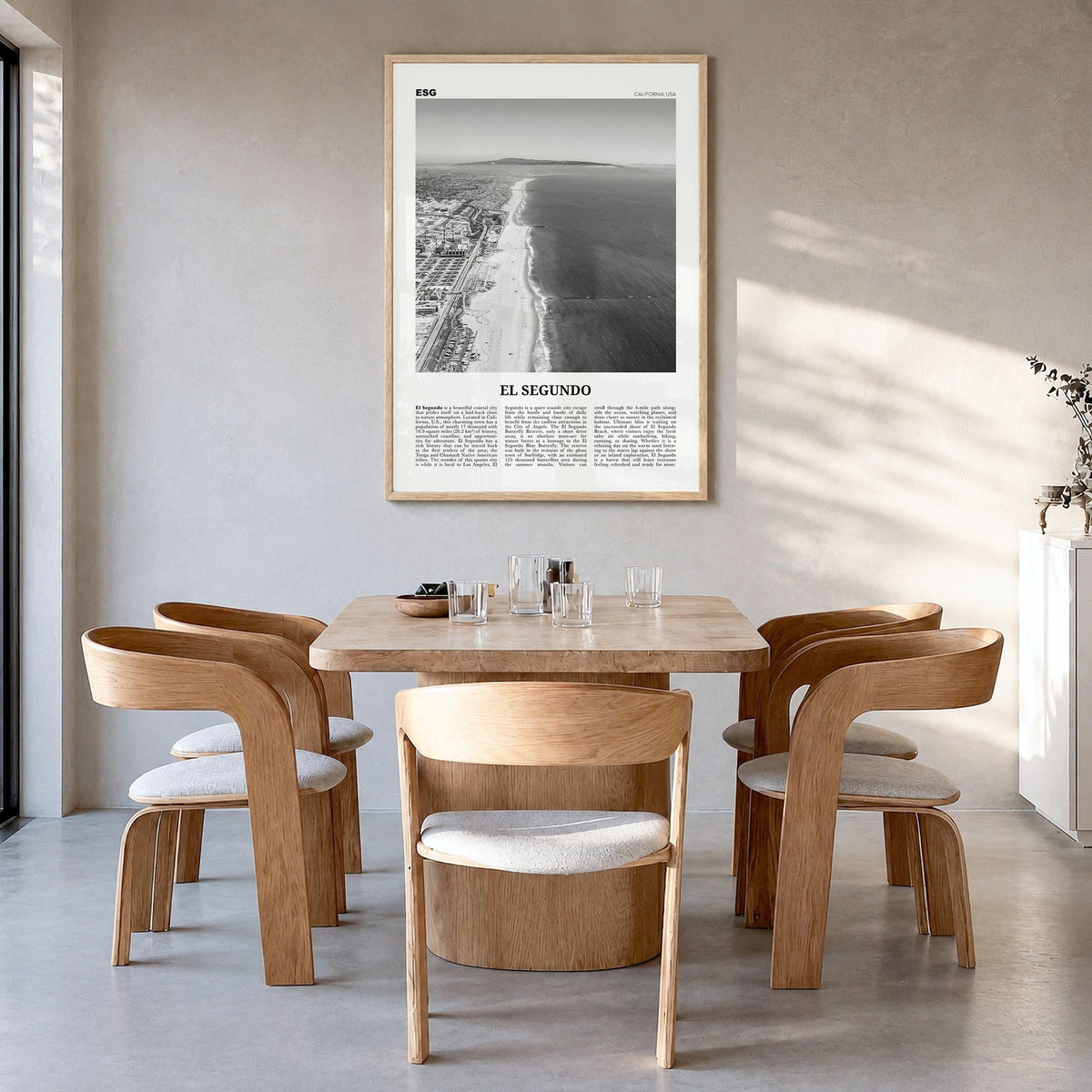 El Segundo Newspaper Poster in a natural wood frame, hanging in a dining room