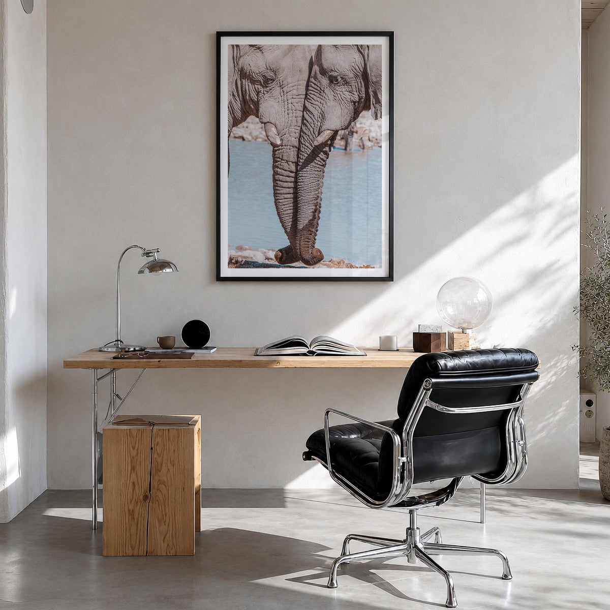 Elephant Couple colorful photo poster – vertical wall art in black wood frame with white border, hanging on wall