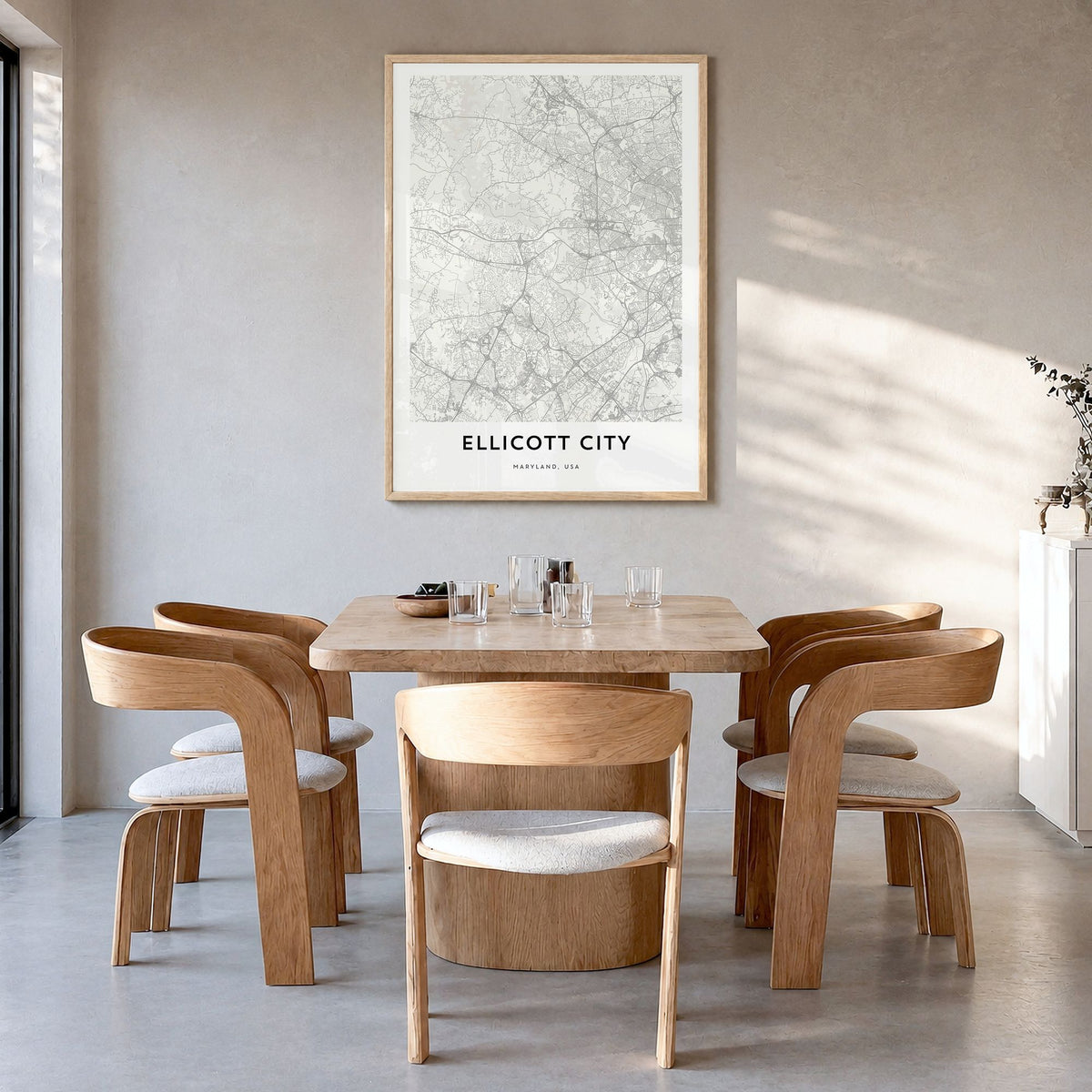 Ellicott City Map Poster in a natural wood frame, hanging in a dining room